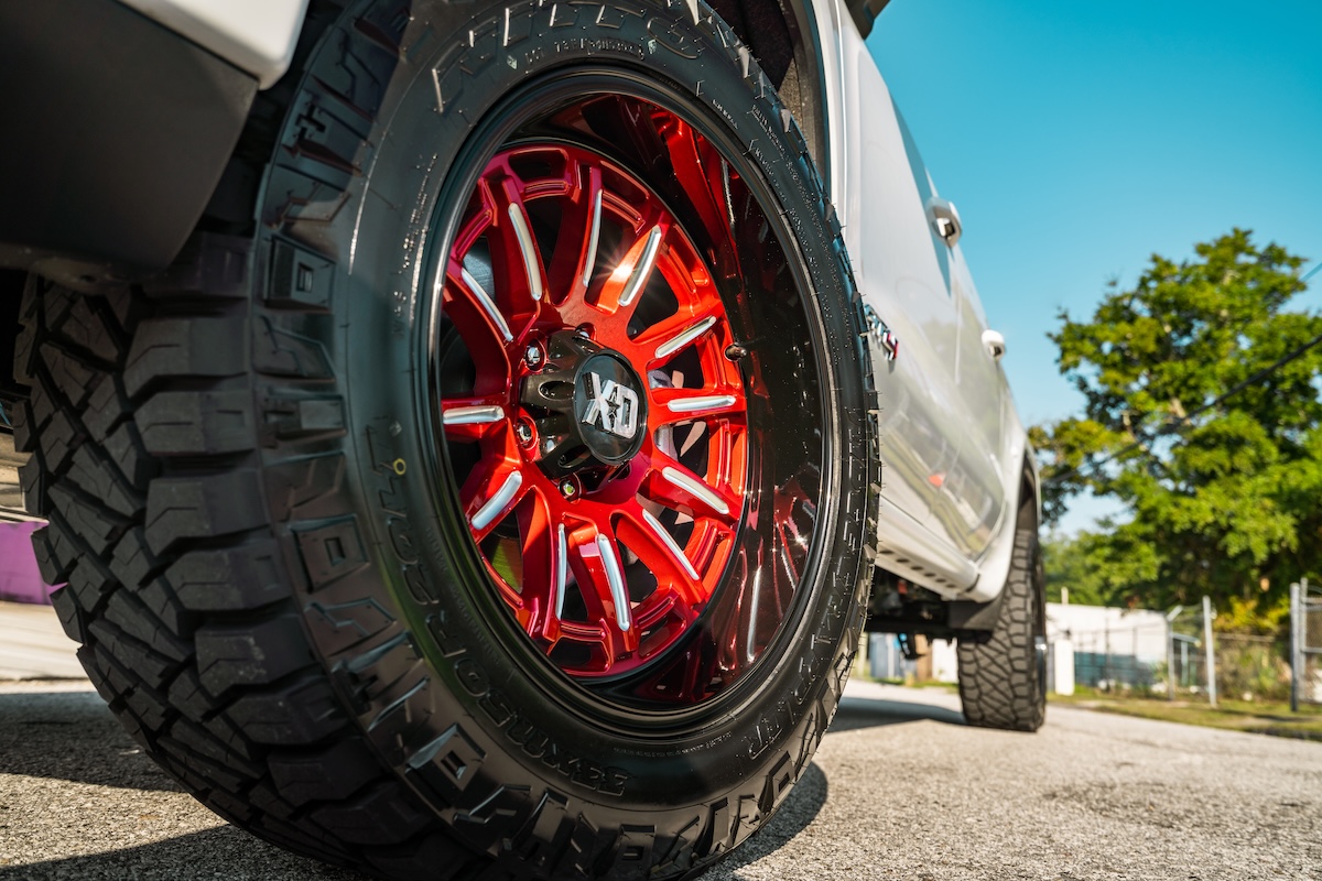 Truck on red XD wheels with VNOX hardware